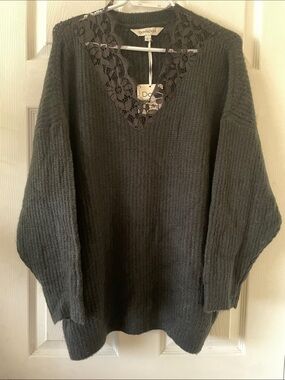 Soft oversized black sweater with eyelash lace neckline